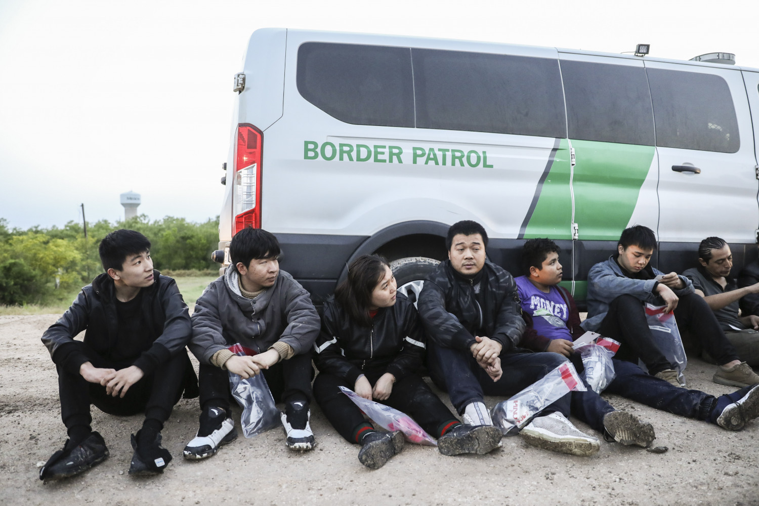 Seven illegal immigrants from China, one from Mexico, and one from El Salvador being apprehended by Border Patrol after they tried to evade capture while crossing the Rio Grande from Mexico into the United States near McAllen, Texas, on April 18, 2019. (Charlotte Cuthbertson/The Epoch Times)
