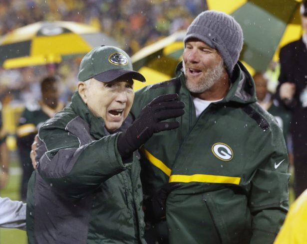 Brett Favre, right, smiles at Bart Starr during a ceremony at halftime of an NFL football game between the Green Bay Packers and Chicago Bears in Green Bay, Wis., on Nov. 26, 2015. (Mike Roemer/AP Photo)