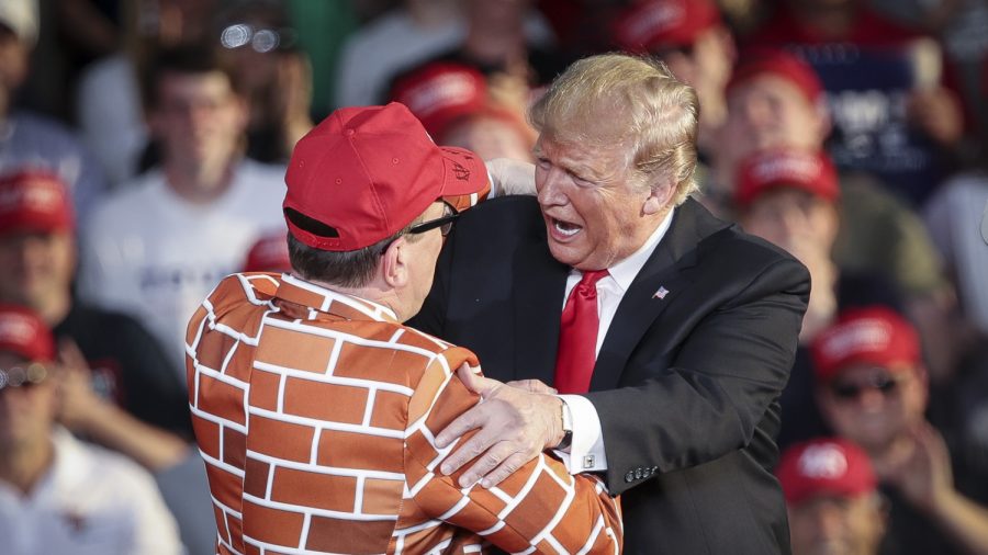 Trump Brings Man Wearing Wall Suit on Stage During Rally
