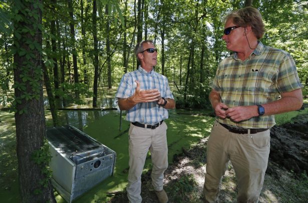 Clay Adcock, right, discusses his efforts to shore up the levee that rests outside his home and business barns in Holly Bluff, Miss., with farmer Charles McClintock, as backwater flooding continues in the Mississippi Delta, on May 23, 2019. (Rogelio V. Solis/AP Photo)