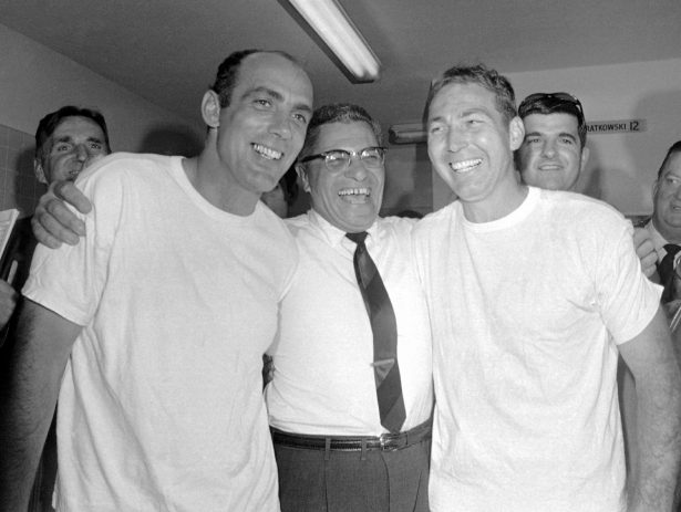 Green Bay Pakers coach Vince Lombardi (C) embraces kicker Don Chandler (L) and quarterback Bart Starr (R) after winning football's Super Bowl II against the Oakland Raiders, in Miami, on Jan. 14, 1968. (AP Photo, File)