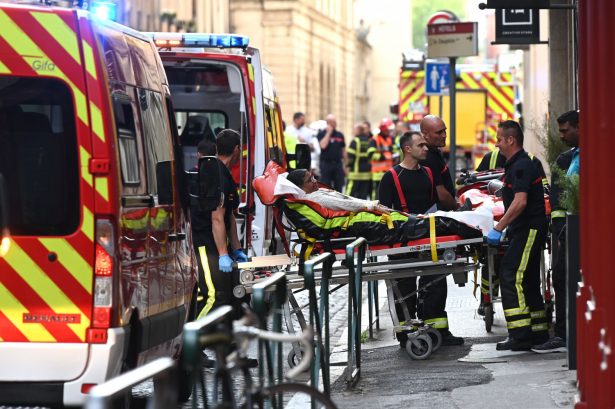 Emergency workers stretcher a woman to a waiting ambulance in Lyon on May 24, 2019. (Philippe Desmazes/AFP/Getty Images)