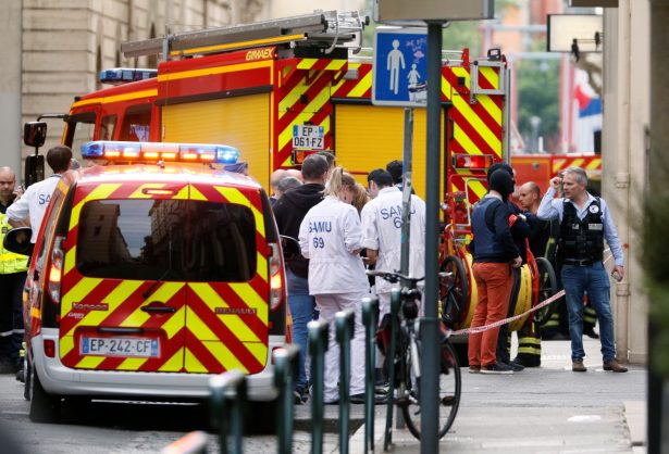 Medics are seen near the site of a suspected bomb attack in central Lyon, France, on May 24, 2019. (Emmanuel Foudrot/Reuters)