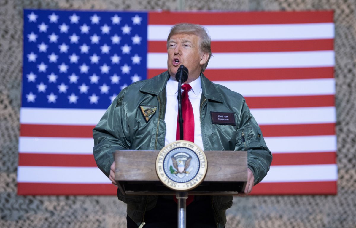 President Donald Trump speaks to members of the US military during an unannounced trip to Al Asad Air Base in Iraq on Dec. 26, 2018. (Saul Loeb/AFP/Getty Images)