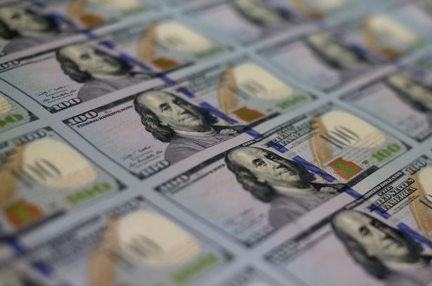 Newly redesigned $100 notes lay in stacks at the Bureau of Engraving and Printing in Washington, DC, on May 20, 2013. (Mark Wilson/Getty Images)
