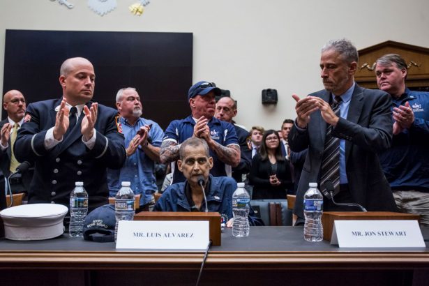 Retired Fire Department of New York Lieutenant and 9/11 responder Michael O'Connell (L), FealGood Foundation co-founder John Feal, (C), and former Daily Show Host Jon Stewart (R), following testimony from Retired New York Police Department detective and 9/11 responder Luis Alvarez in Washington, on June 11, 2019. (Zach Gibson/Getty Images)