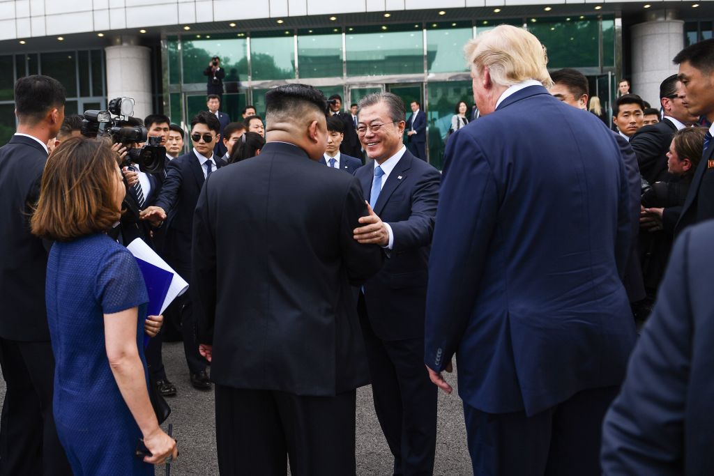 North Korea's leader Kim Jong Un (centre L) meets with South Korea's President Moon Jae-in (C) as US President Donald Trump (centre R) looks on south of the Military Demarcation Line that divides North and South Korea, in the Joint Security Area (JSA) of Panmunjom in the Demilitarized zone (DMZ) on June 30, 2019. (BRENDAN SMIALOWSKI/AFP/Getty Images)