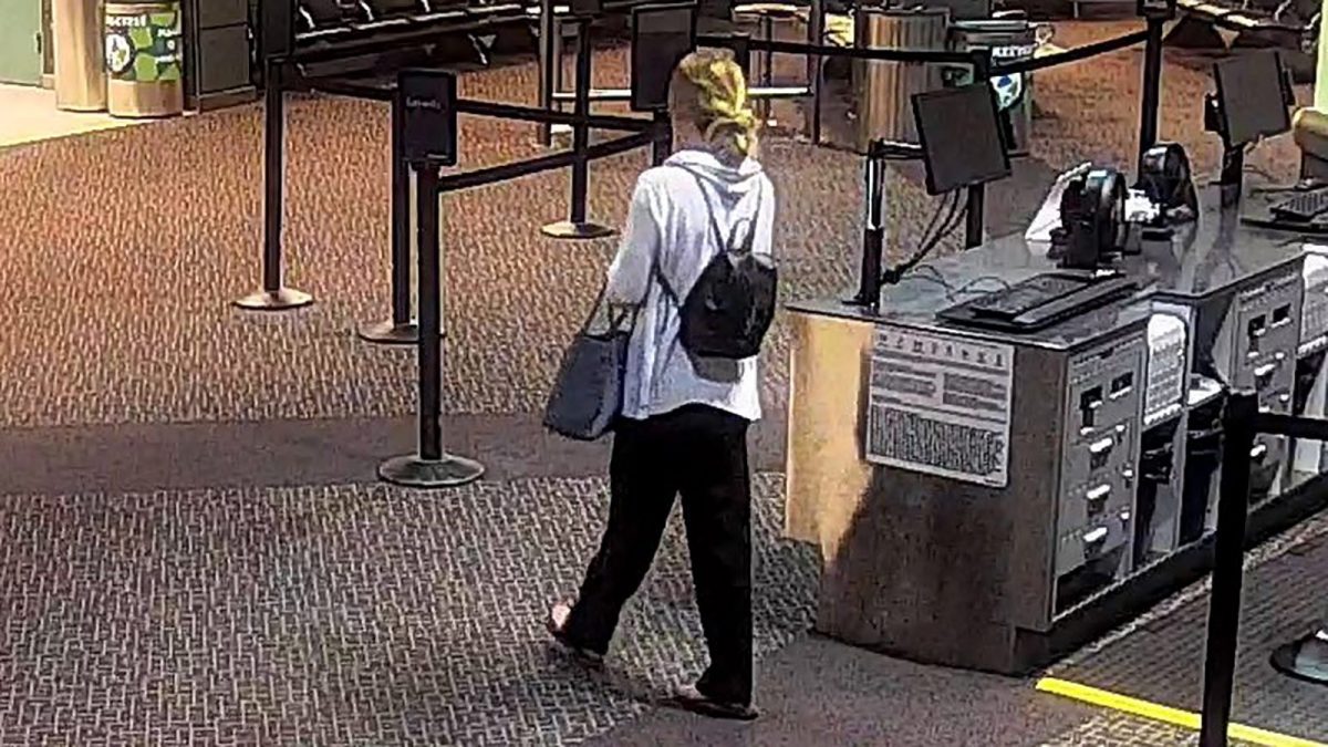 Mackenzie Lueck, 23, is seen leaving the departure area at Salt Lake City International Airport. (Salt Lake City Airport/PD via CNN)