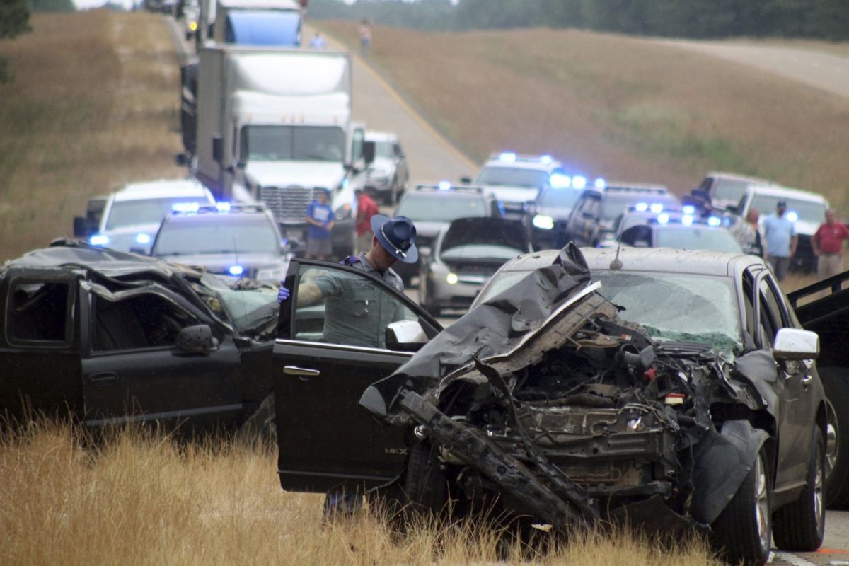 A Mississippi Highway Patrol state trooper investigates a wreck on U.S. Highway 45 south of Scooba in Kemper County, Miss., on June 5, 2019. (Bill Graham/The Meridian Star via AP)