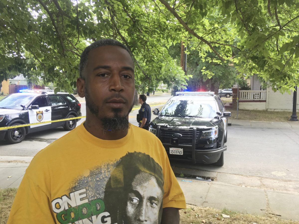 Muhammed Ilyas talks with a reporter near the scene where a police officer was killed by Adel Sambrano Ramos in Sacramento, Calif., on June 20, 2019. (AP Photo/Don Thompson)