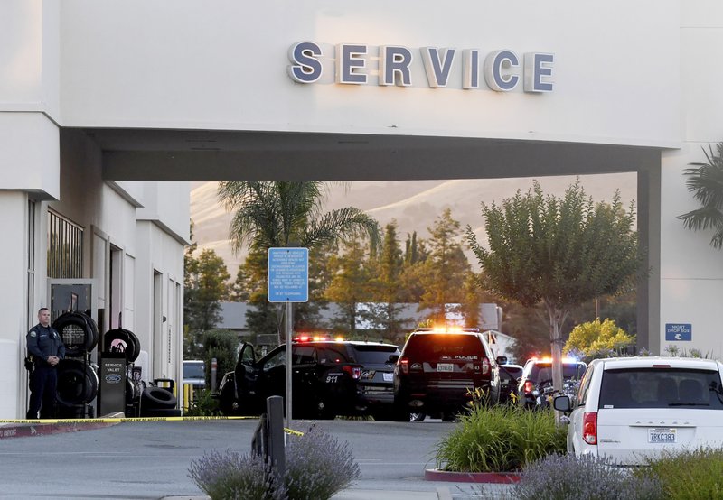 Police investigate at the scene of a shooting at the Morgan Hill Ford Store in Morgan Hill, Calif., on June 25, 2019. (Nic Coury/Photo via AP)
