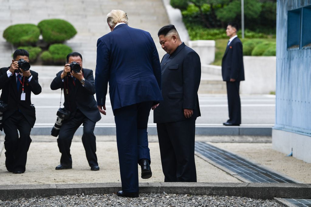 North Korea's leader Kim Jong Un invites President Donald Trump to step into the northern side of the Military Demarcation Line that divides North and South Korea at the Joint Security Area (JSA) of Panmunjom in the Demilitarized zone (DMZ) on June 30, 2019. (BRENDAN SMIALOWSKI/AFP/Getty Images)