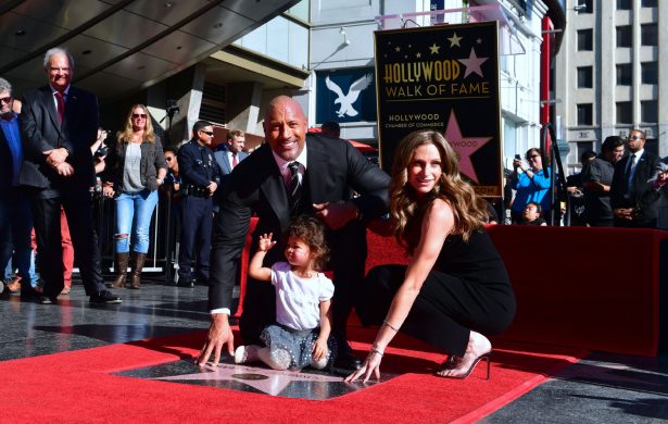 Dwayne Johnson, his wife Lauren Hashian, and daughter Jasmine pose on his Hollywood Walk of Fame Star is unveiled in Hollywood, California on December 13, 2017. (Frederic J. Brown/AFP/Getty Images)