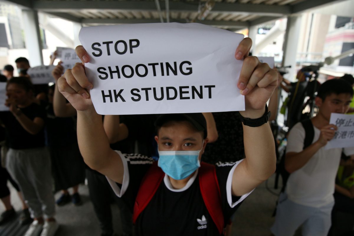 A protester holds a sign following a day of violence over an extradition bill that would allow people to be sent to mainland China for trial, in Hong Kong, on June 13, 2019. (Athit Perawongmetha/Reuters)