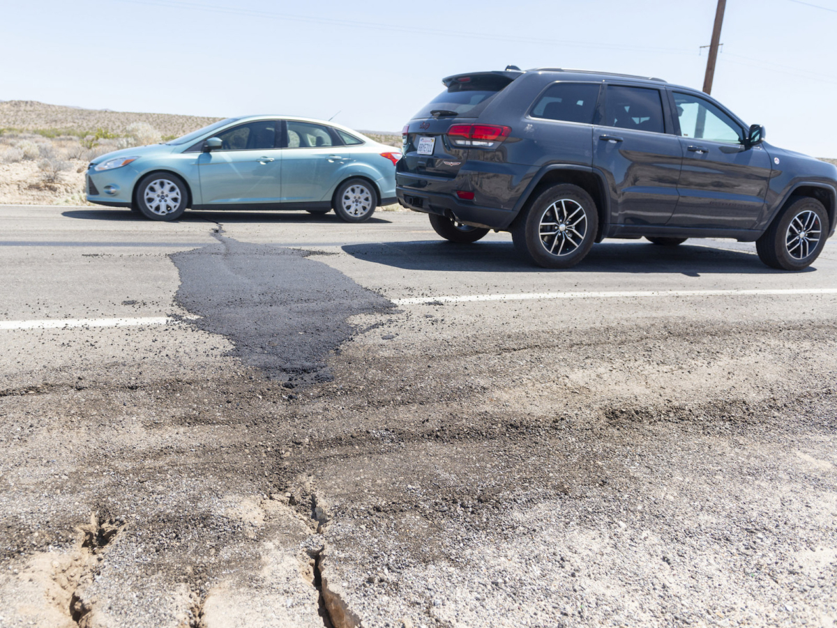 Traffic drives over a patched section of Highway 178 between Ridgecrest and Trona CA on Friday July 5, 2019. The fourth of July earthquake caused damage in both towns. (James Quigg, Daily Press)