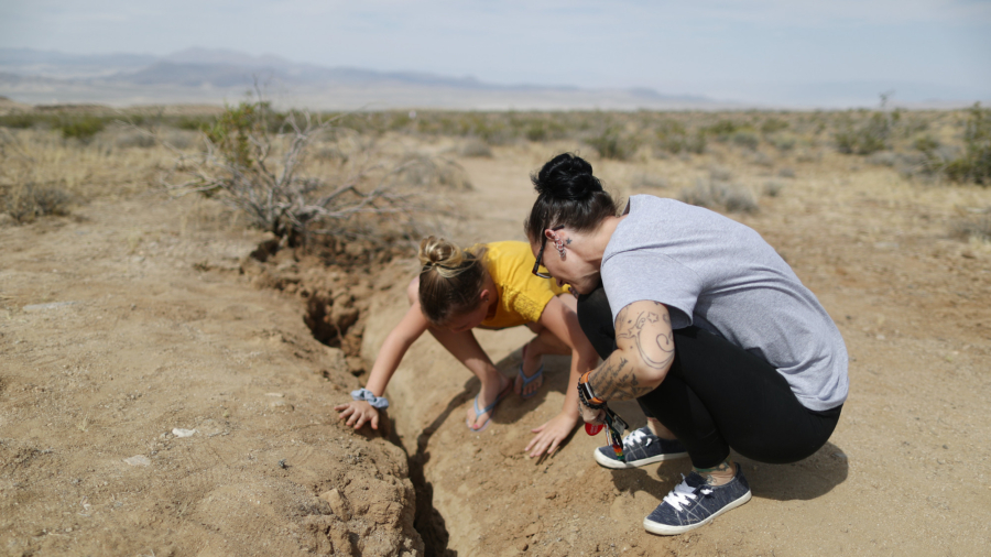 People Take Pictures Near and Inside Cracks Left by California Earthquake