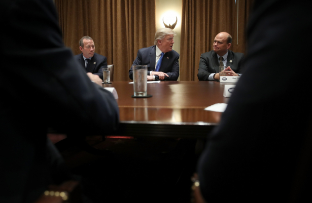 President Donald Trump meets with members of Congress, including Rep. Josh Gottheimer (D-N.J.) (L) and Rep. Tom Reed (R-N.Y.) in the Cabinet Room of the White House in Washington on Sept. 13, 2017. (Win McNamee/Getty Images)