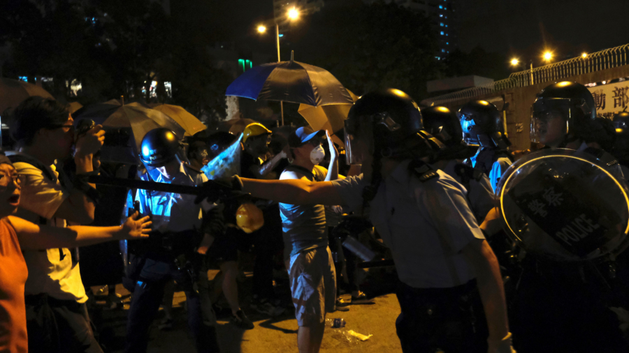 New Protest Erupts as Hong Kong Charges 44 Activists With Rioting