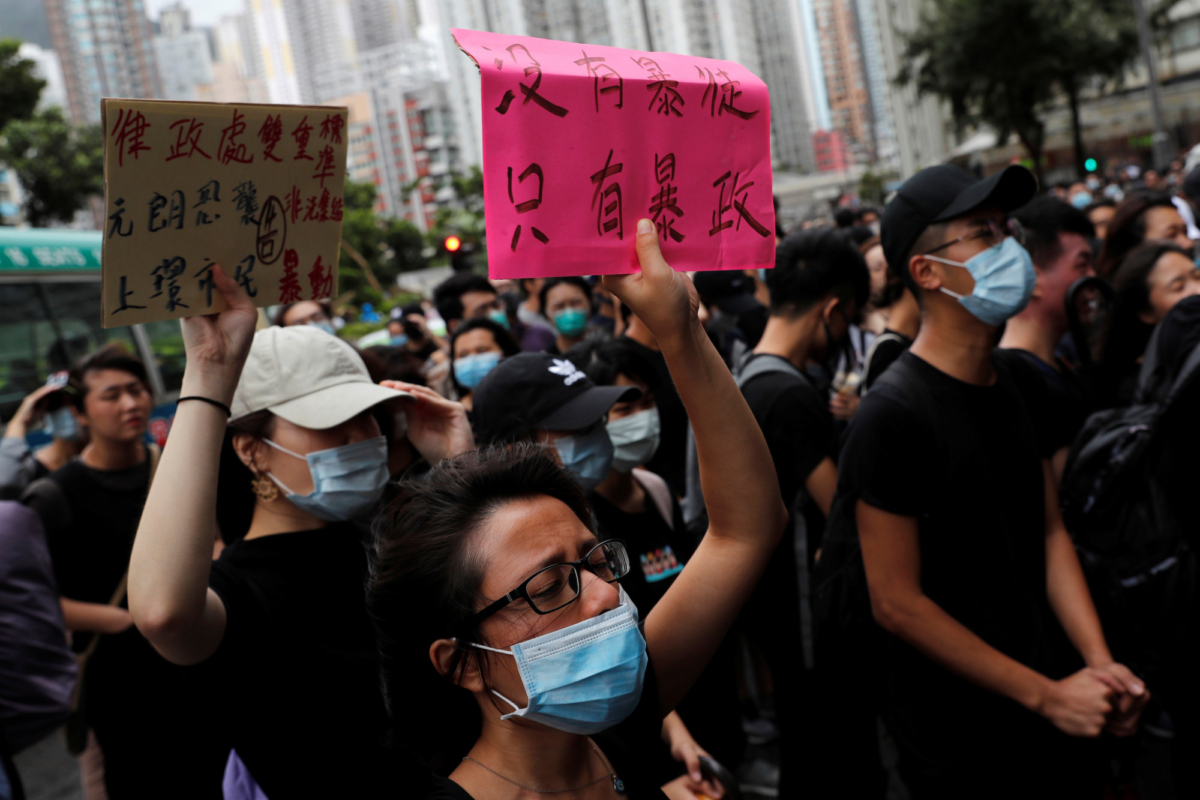 Supporters gather outside the Eastern Courts to support the arrested anti-extradition bill protesters who face rioting charges, in Hong Kong, China on July 31, 2019. The placard reads, "There is no thugs, only tyranny." (Tyrone Siu/Reuters)