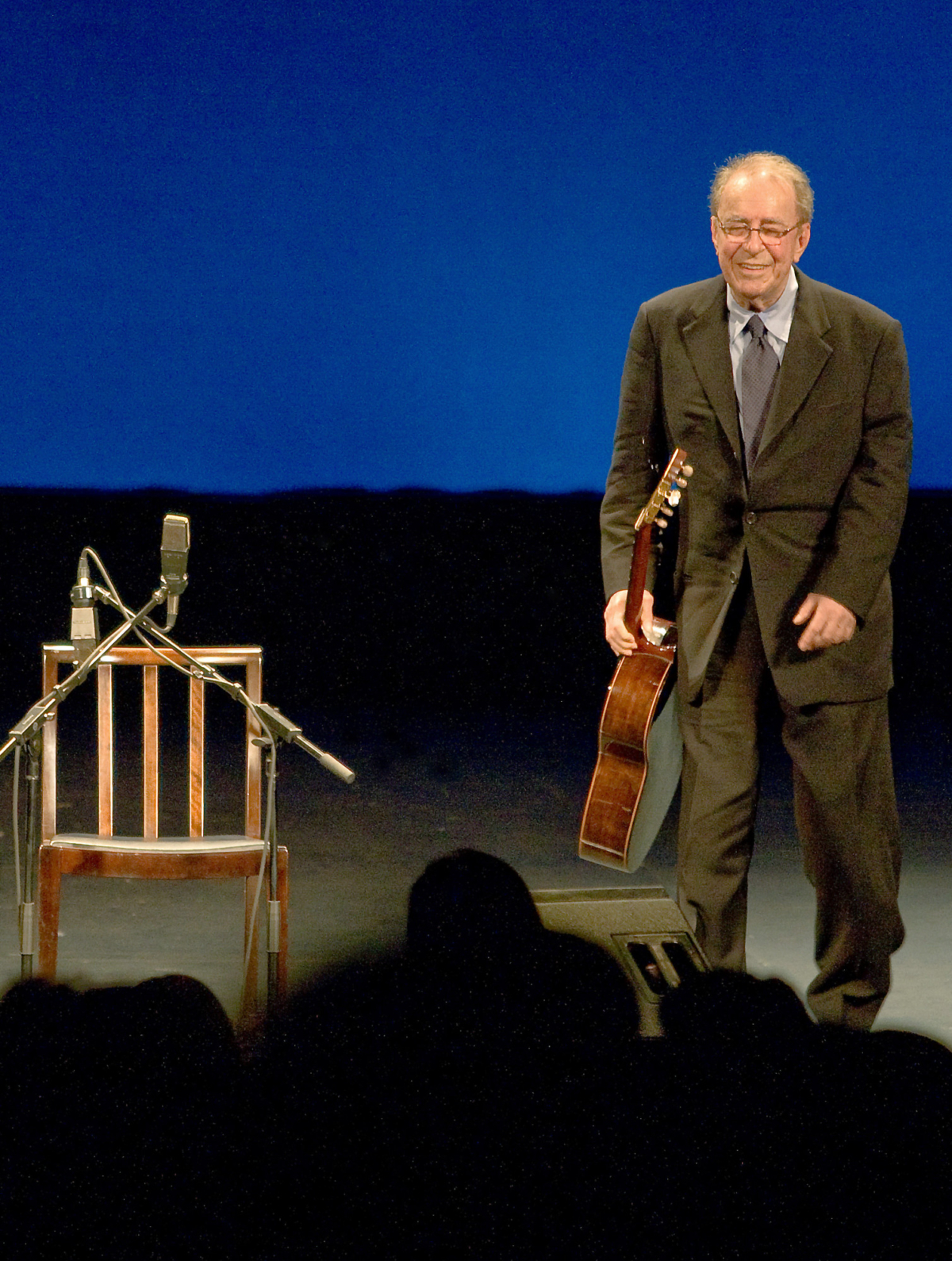 Brazilian musician Joao Gilberto, 77, walks on stage before his presentation late at night at the Teatro Municipal in Rio de Janeiro on Aug. 24, 2008. (ARI VERSIANI/AFP/Getty Images)