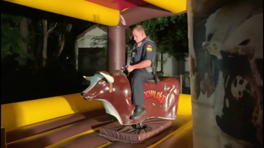 Texas Police Officer Responds to Noise Complaint and Winds up Riding Mechanical Bull