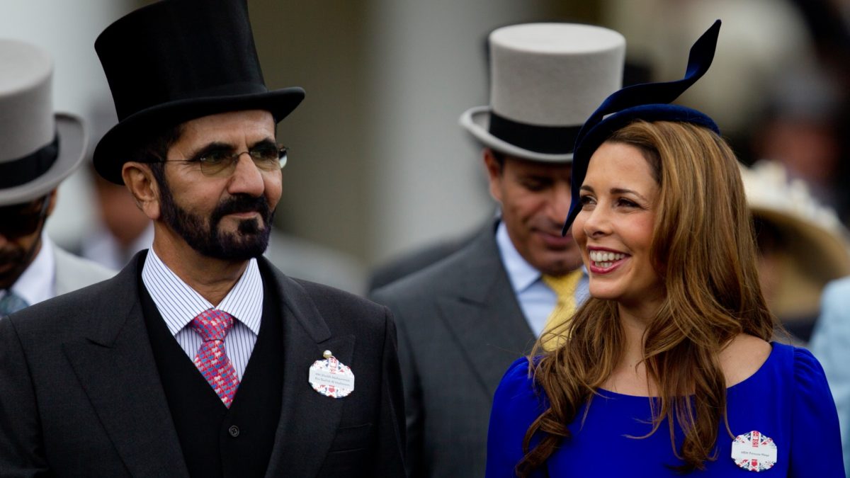 Sheikh Mohammed Al Maktoum and his wife Princess Haya of Jordan walk towards the paddock on the second day of Royal Ascot horse race meeting at Ascot, England on June 20, 2012. (Alastair Grant/File Photo via AP)