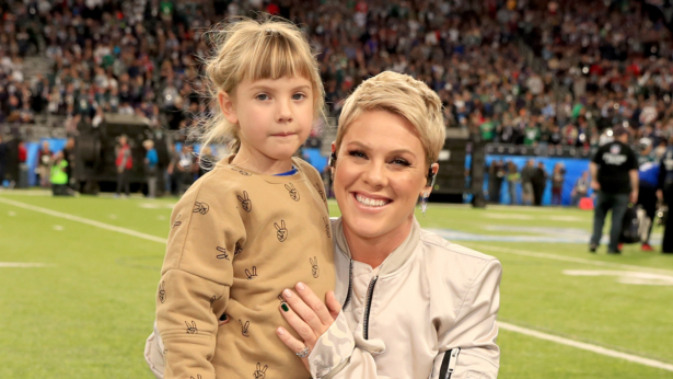 Recording artist Pink (R) poses with daughter Willow Sage Hart before the National Anthem during the Super Bowl LII Pregame show at U.S. Bank Stadium in Minneapolis, Minn., on Feb. 4, 2018. (Photo by Christopher Polk/Getty Images)