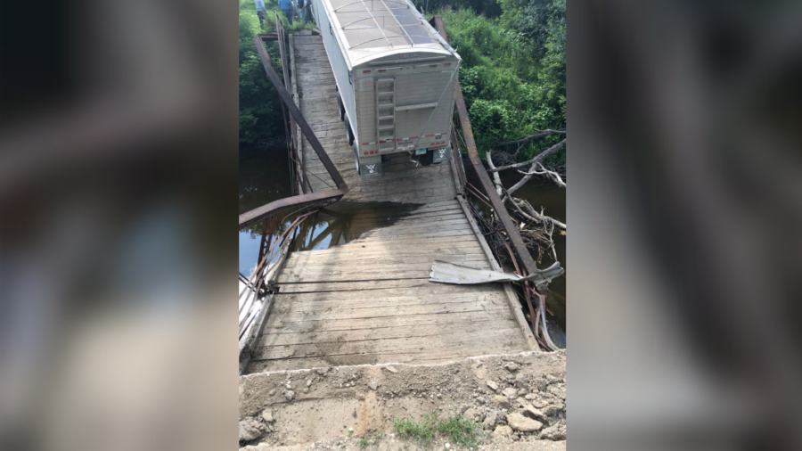 Pictured: 100-Year-Old Bridge Collapses Under Semitruck Nearly Four Times Over Weight Limit