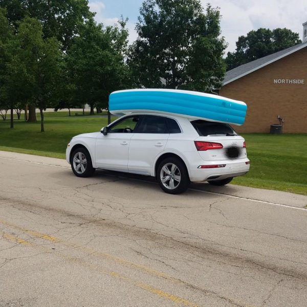 The white Audi Q5 that was pulled over with two children in the pool on the roof in Dixon, Illinois on July 9, 2019. (Dixon Police Department)