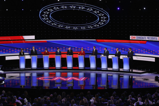 Democratic presidential candidate Sen. Elizabeth Warren (D-Mass.) (C) speaks while author Marianne Williamson, (L-R), Rep. Tim Ryan (D-Ohio), Sen. Amy Klobuchar (D-Minn.), Indiana Mayor Pete Buttigieg, Sen. Bernie Sanders (I-Vt.), former Texas congressman Beto O'Rourke, former Colorado governor John Hickenlooper, former Maryland congressman John Delaney, and Montana Gov. Steve Bullock take the stage at the beginning of the Democratic Presidential Debate in Detroit, Michigan at the Fox Theatre on July 30, 2019. (Justin Sullivan/Getty Images)
