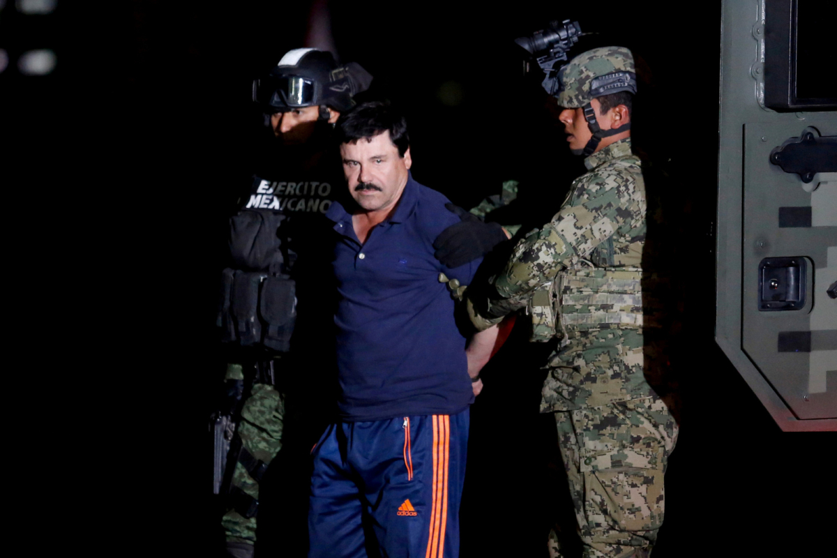 Joaquin "El Chapo" Guzman is escorted by soldiers during a presentation in Mexico City, on Jan. 8, 2016. (Tomas Bravo/Reuters)