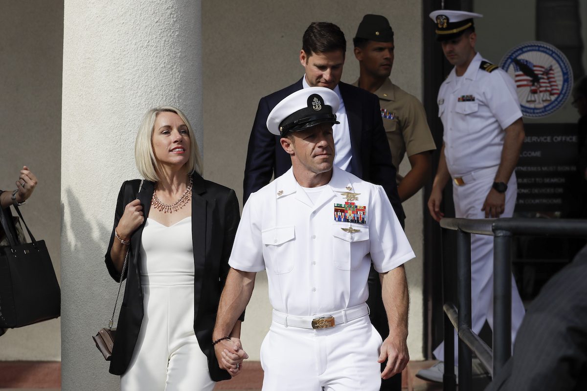 Navy Special Operations Chief Edward Gallagher, center, walks with his wife, Andrea Gallagher, as they leave a military court on Naval Base San Diego, in San Diego on July 2, 2019. (Gregory Bull/AP Photo)