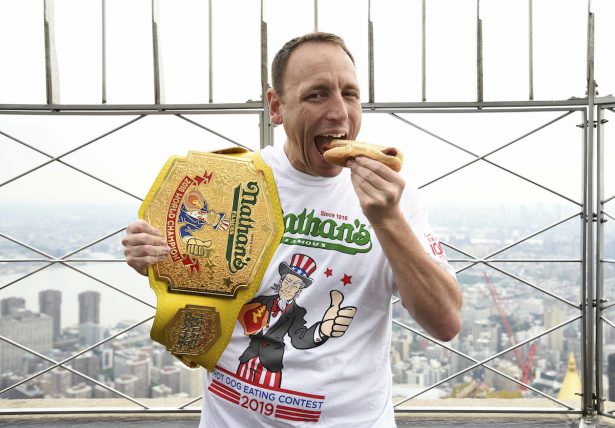 Joey Chestnut poses on the 86th floor observation deck during the Nathan's Famous international Fourth of July hot dog eating contest weigh-in at the Empire State Building on July 3, 2019, in New York. (Evan Agostini/Invision/AP)