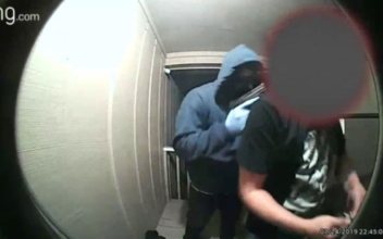 Surveillance Video Shows Armed Men Forcing Father Into House at Gunpoint