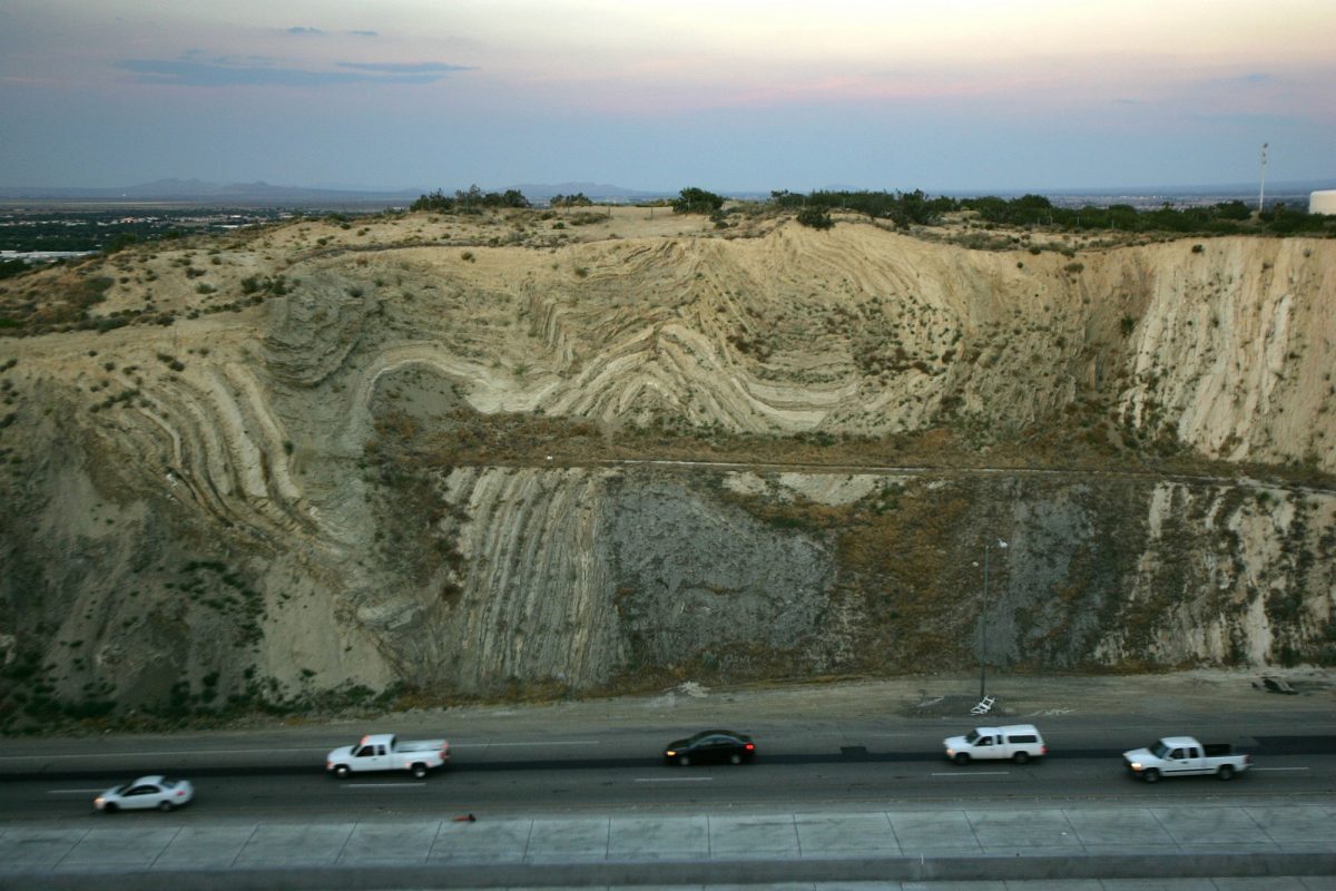 Layers of earthquake-twisted ground are seen at dusk where the 14 freeway crosses the San Andreas Fault in a 2006 file photo near Palmdale, California. (David McNew/Getty Images)