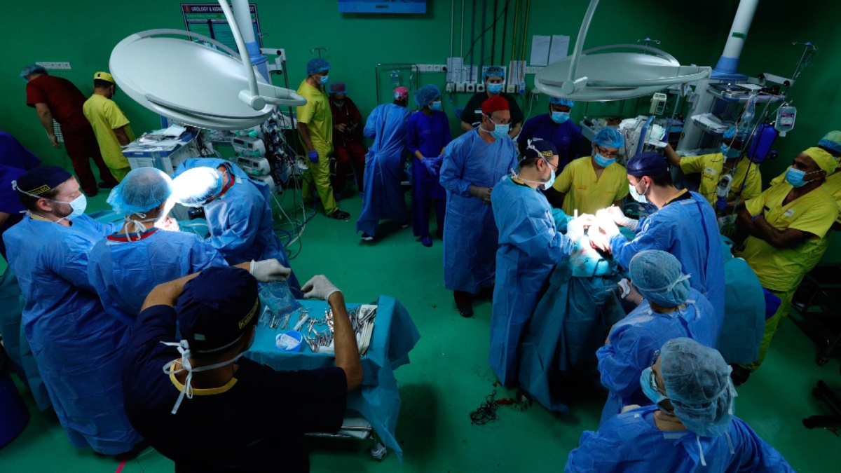 Hungarian doctors Gergely Pataki, left, and Andras Csokay perform separation surgery on Rabeya and Rukaya. (Andras Taborosi/Action for Defenseless People Foundation via AP)