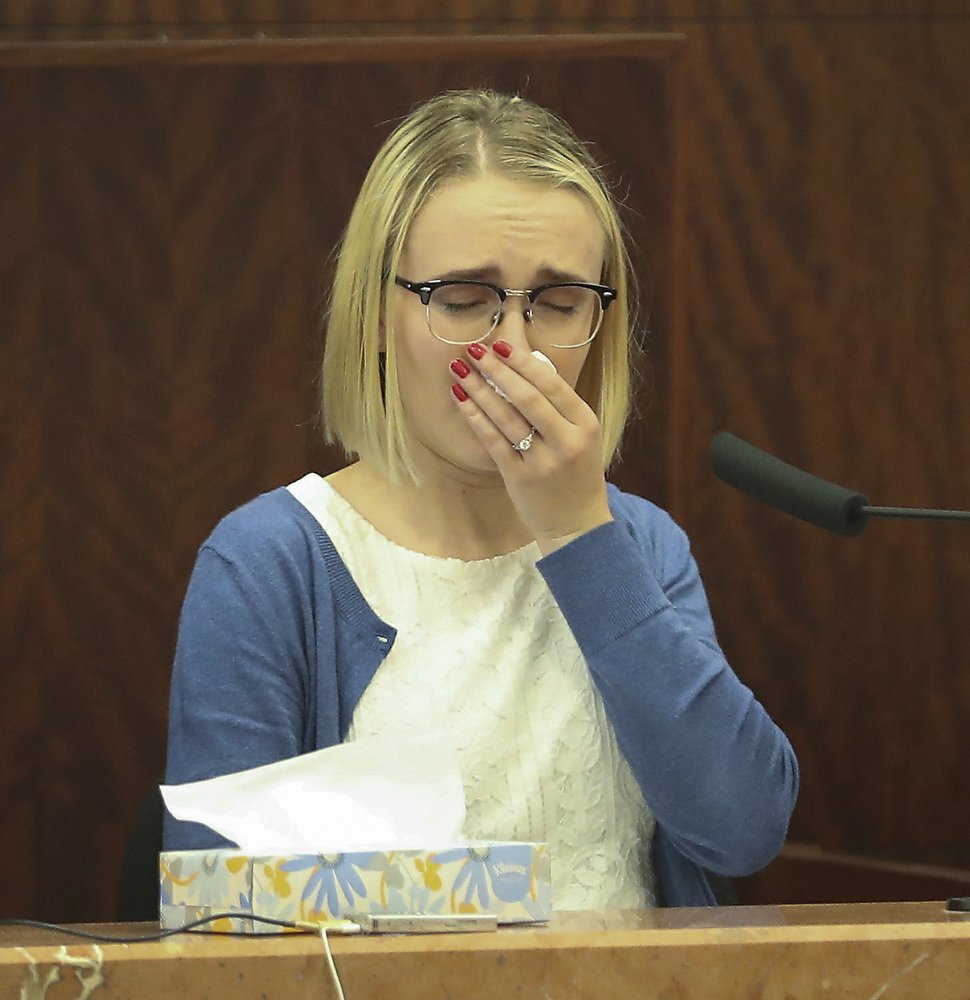 Cassidy Stay reacts as a first responder tape is played during Ronald Haskell capital murder trial in Houston, Texas on Aug. 27, 2019. (Steve Gonzales/Houston Chronicle via AP)