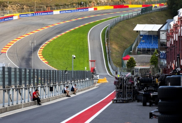 Mechanics sit in a deserted pit lane following a serious accident involving several drivers during a Formula 2 race at the Spa-Francorchamps circuit in Spa, Belgium, on August 31, 2019. (REMKO DE WAAL/AFP/Getty Images)