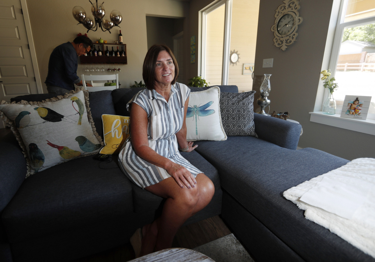 Jennifer Mogensen talks about her adopted sister on Aug. 12, 2019. (David Zalubowski/AP Photo)
