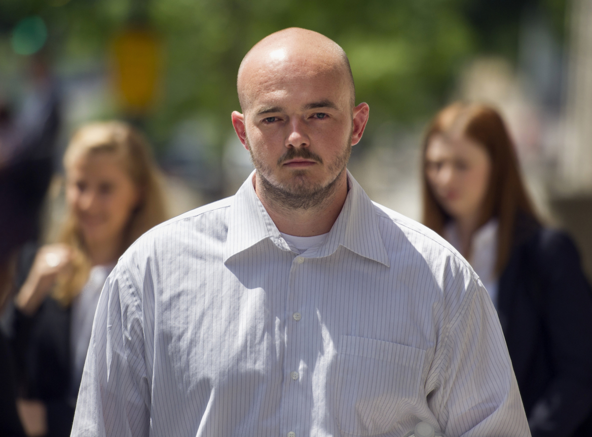 Former Blackwater Worldwide guard Nicholas Slatten leaves federal court in Washington, after the start of his first-degree murder trial on June 11, 2014. (AP Photo/Cliff Owen)