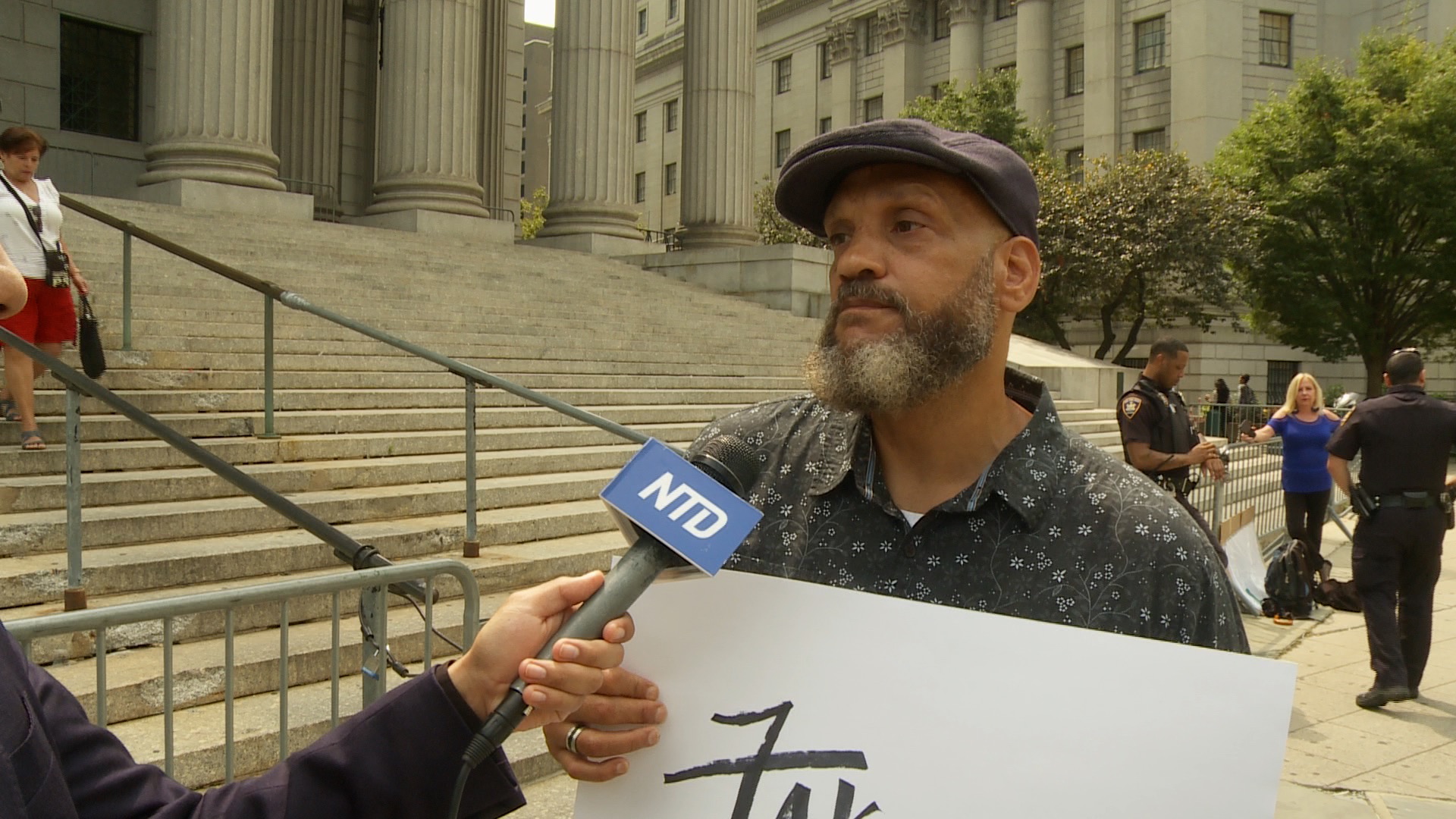Plaintiff Andre Jones interviewed by NTD News out front of the New York County Supreme Court on Aug. 14, 2019. (Miguel Moreno/NTD News)