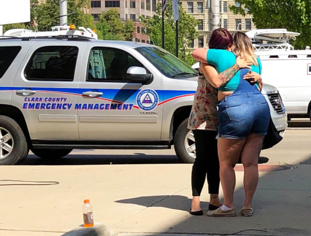 Residents comfort each other as they await word on whether they know any of the victims of a mass shooting in Dayton, Ohio. on Aug. 4, 2019, (Julie Carr Smyth/AP Photo)