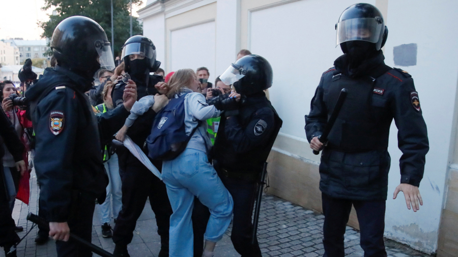 Viral Clip of Russian Policeman Punching Female Protester Stirs Anger