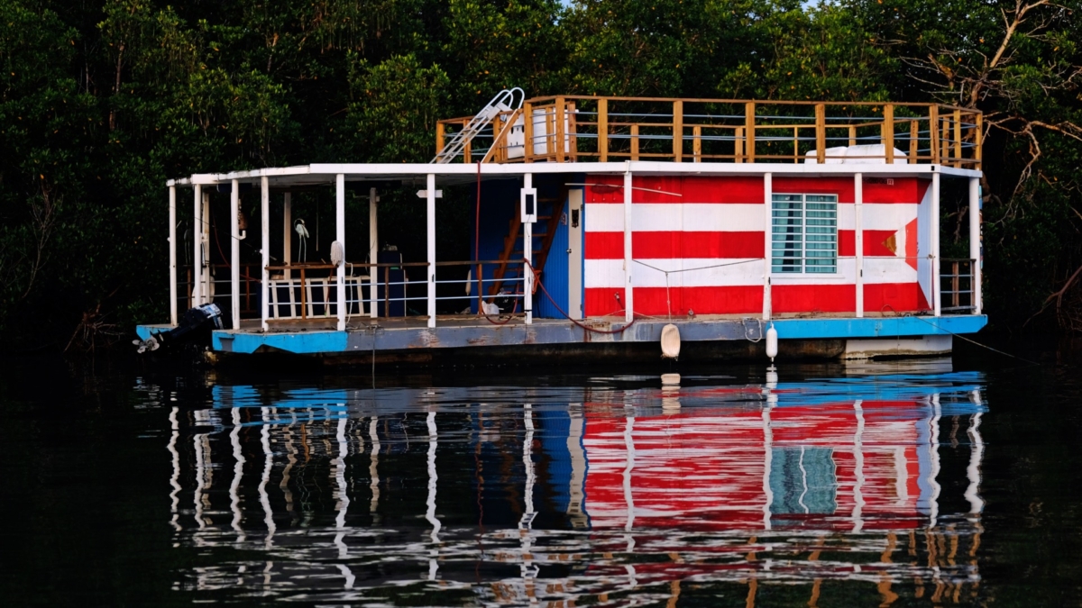 A house boat is seen secured to a mangrove as Tropical Storm Dorian approaches Cabo Rojo, Puerto Rico on Aug. 27, 2019. (Ricardo Arduengo/Reuters)