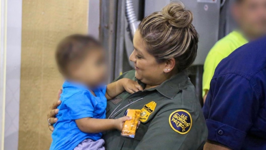 Photo: Border Patrol Agent Comforts Toddler Saved From Traffickers