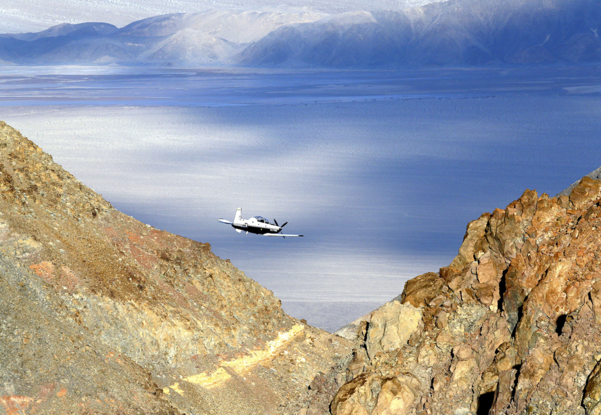 A Beechcraft T-6 Texan II trainer from Sheppard AFB Texas flies out of what is known as Star Wars Canyon, a rugged area over Death Valley National Park in the California desert, on Feb. 27, 2017. (AP Photo/Ben Margot, File)