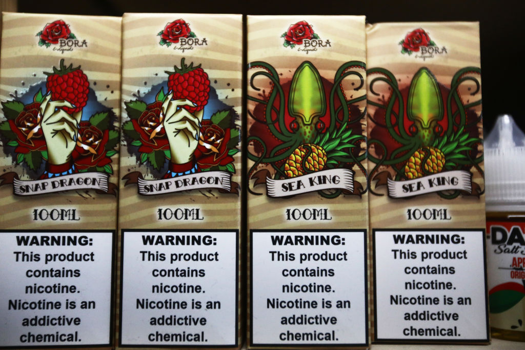 E-liquids are displayed for sale, with nicotine warning labels, in a vape shop in Los Angeles, Calif., on Sept. 6, 2019. (Mario Tama/Getty Images)