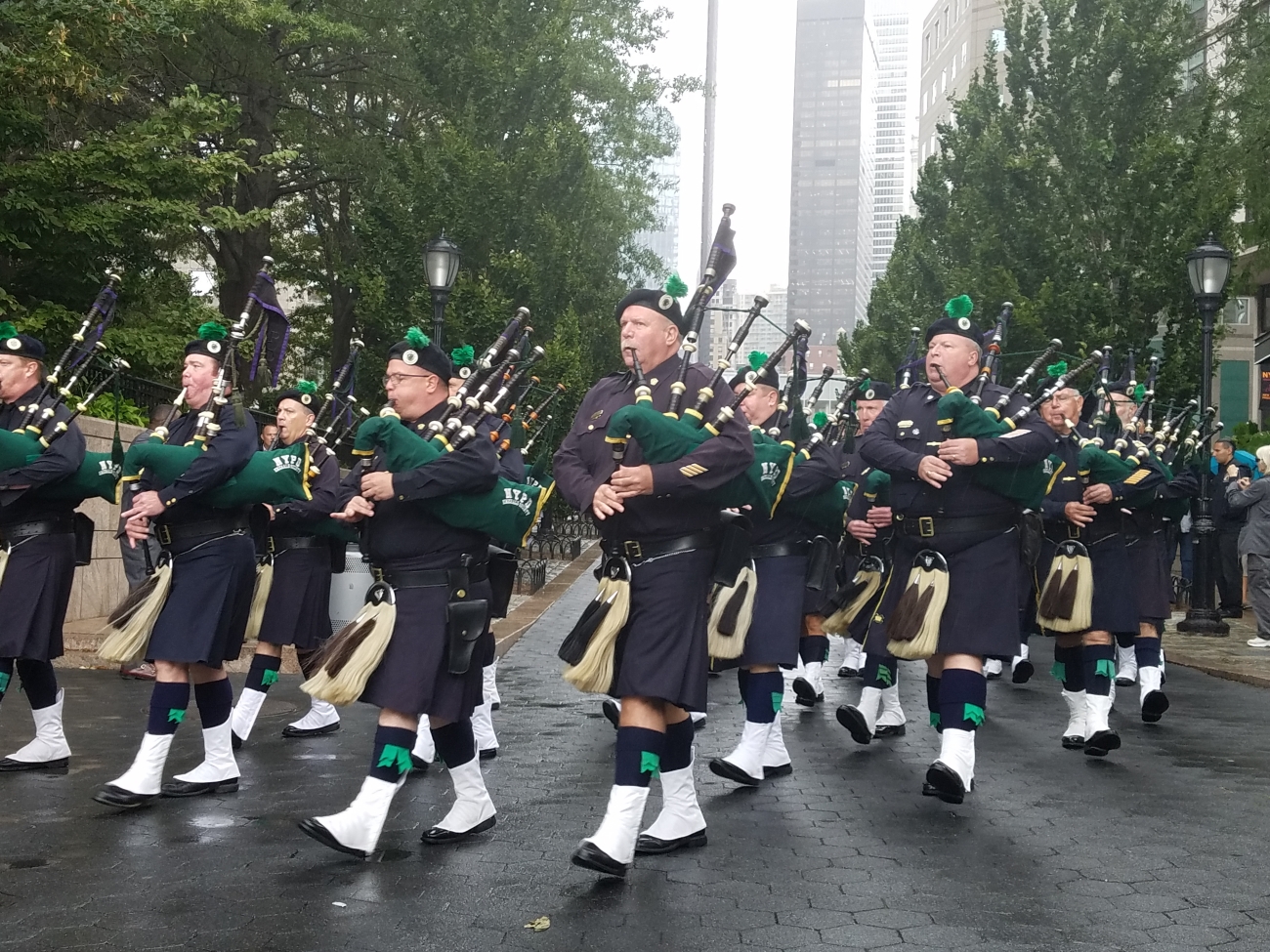 The NYPD Emerald Society Pipes and Drums perform at Battery Park in New York on Sept. 6, 2019. (Miguel Moreno/NTD News)