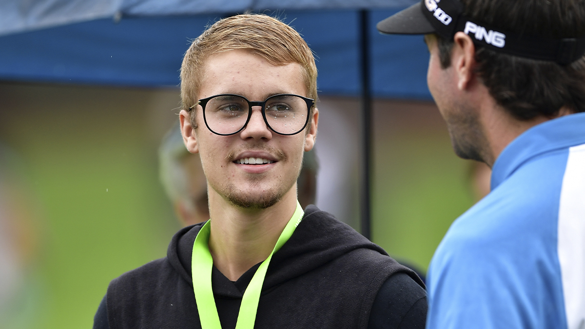 Justin Bieber looks on with Bubba Watson during a practice round prior to the 2017 PGA Championship at Quail Hollow Club in Charlotte, North Carolina, on August 8, 2017. (Stuart Franklin/Getty Images)