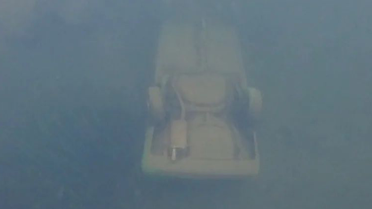 A view of the overturned car resting at the bottom of Griffin Lake. It was discovered just three metres from shore. (RCMP)